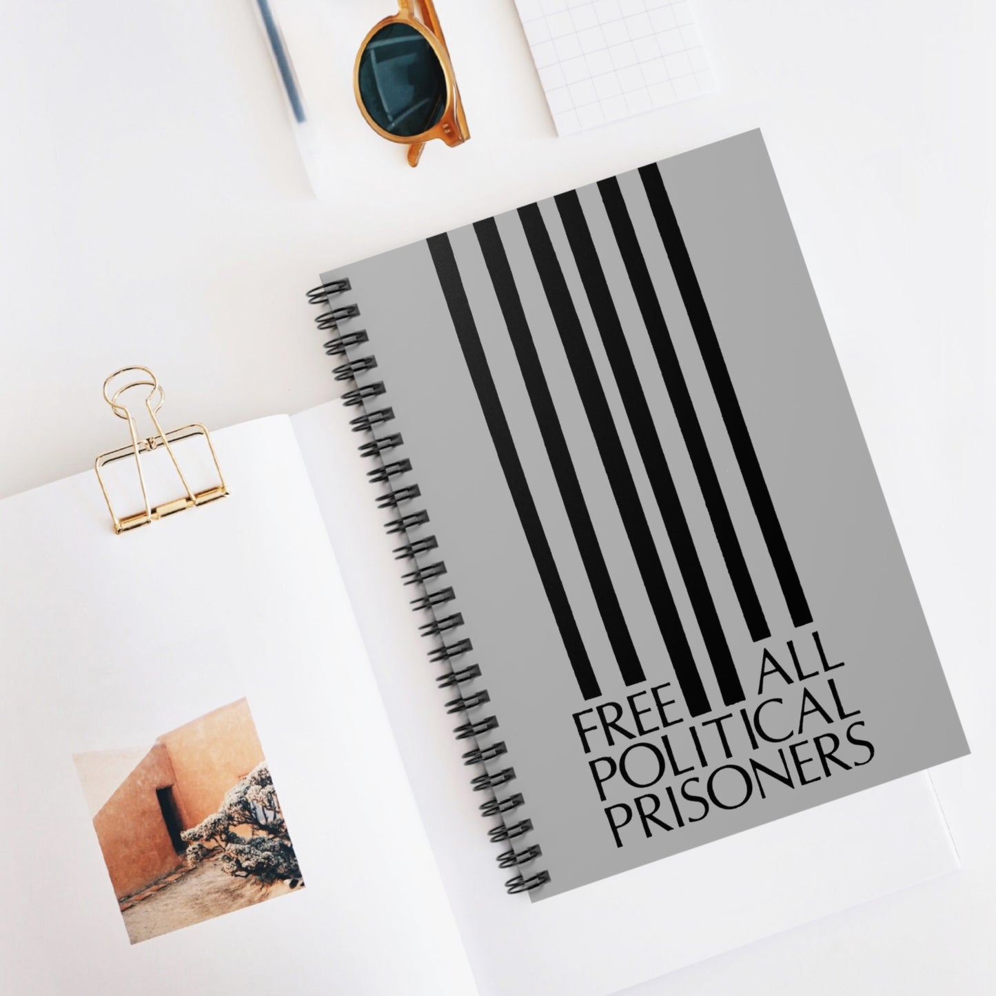 'Free All Political Prisoners' Black on Gray Spiral Notebook - Ruled Line